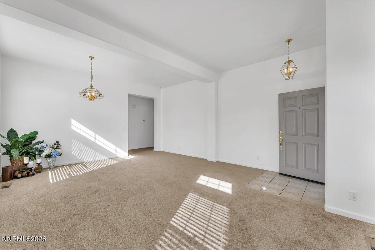 9765 Rock River Drive Reno, NV 89506 - Photo 5 of 25 a view of a livingroom with wooden floor