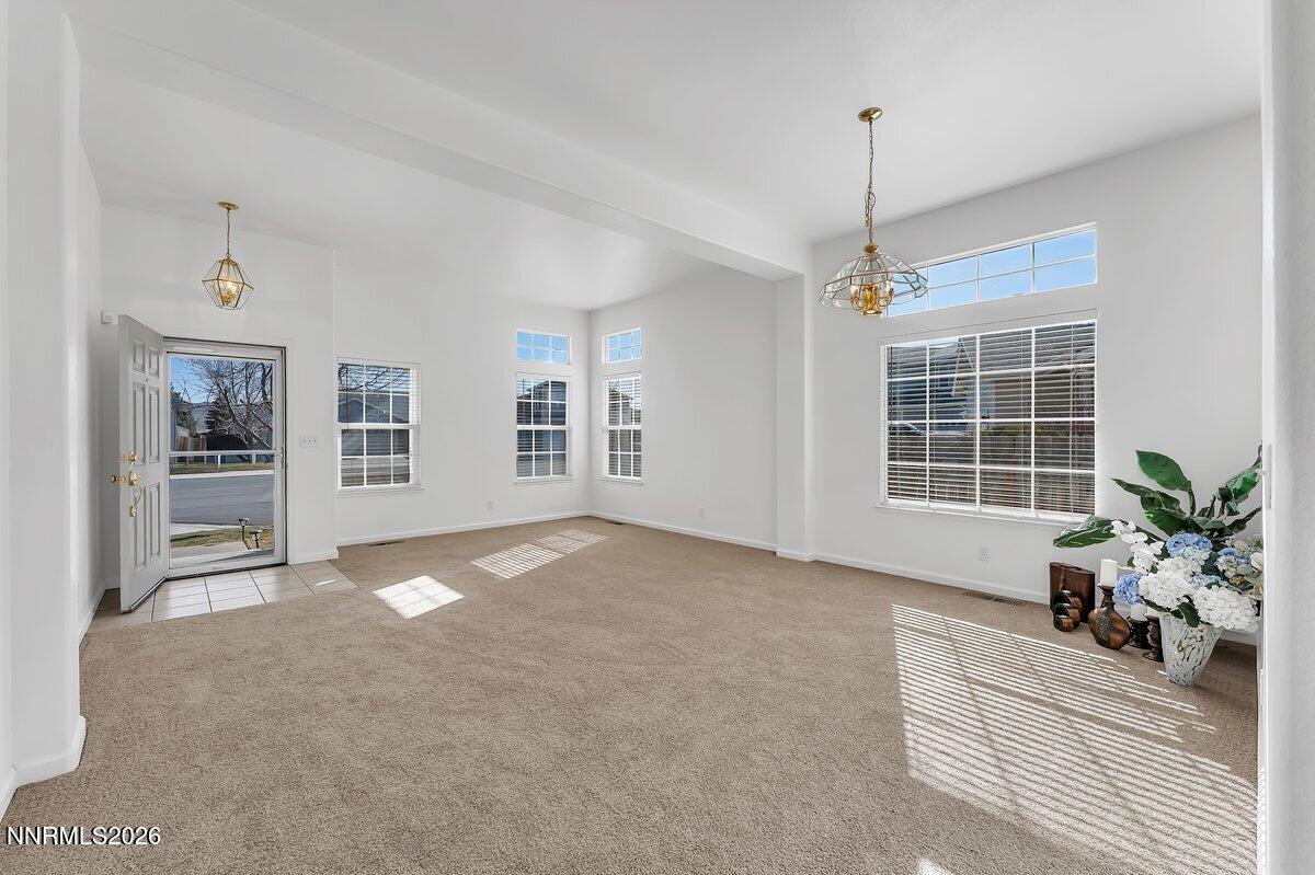 9765 Rock River Drive Reno, NV 89506 - Photo 6 of 25 a view of an empty room with a window