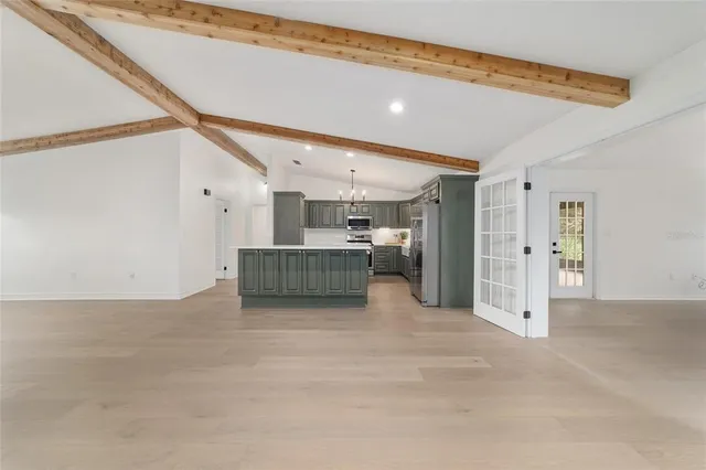 a spacious bathroom with a double vanity sink mirror and bathtub