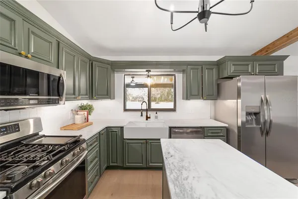 a view of an empty room with a window and closet