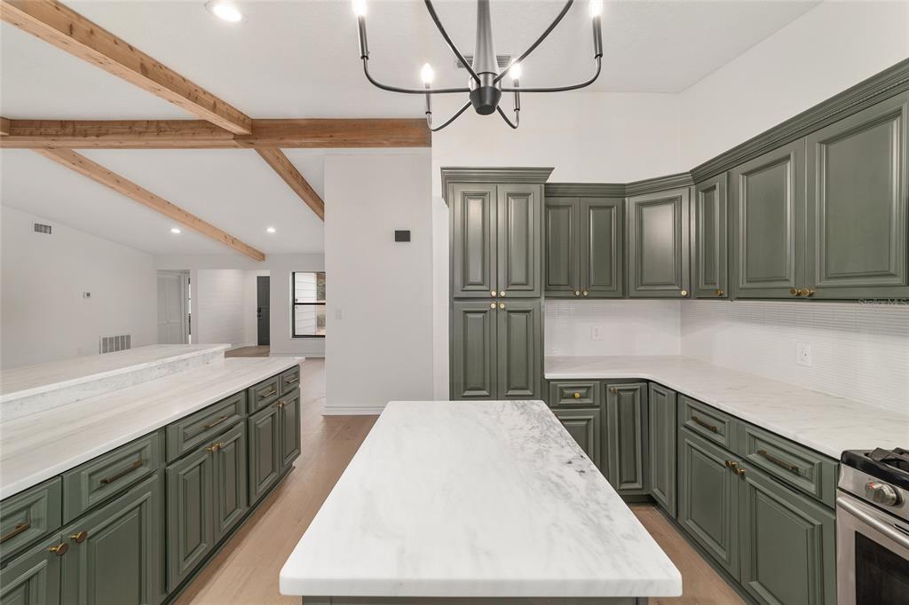 10575 Southwest 27th Avenue Ocala, FL 34476 - Photo 15 of 93 a kitchen with kitchen island a sink appliances and cabinets