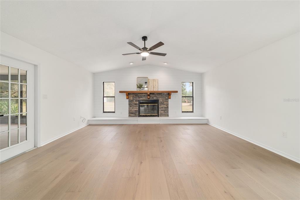 10575 Southwest 27th Avenue Ocala, FL 34476 - Photo 18 of 93 an empty room with windows and fireplace