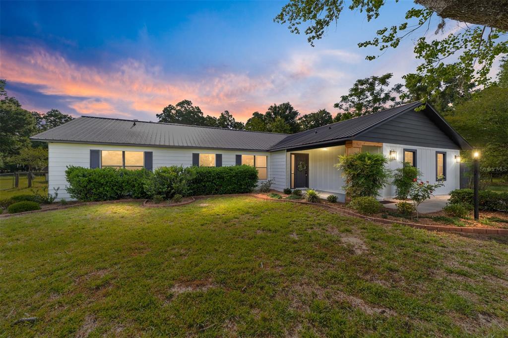 10575 Southwest 27th Avenue Ocala, FL 34476 - Photo 2 of 95 a view of a house with a yard