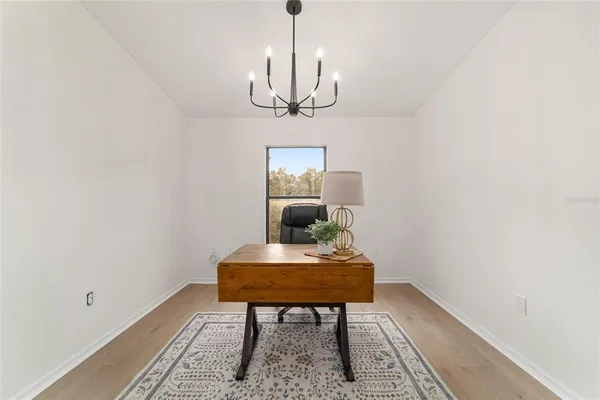 a aerial view of a house with pool lake view and mountain view