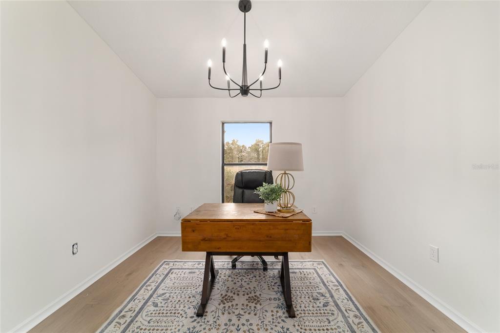 10575 Southwest 27th Avenue Ocala, FL 34476 - Photo 25 of 93 a view of a room with a table and chairs