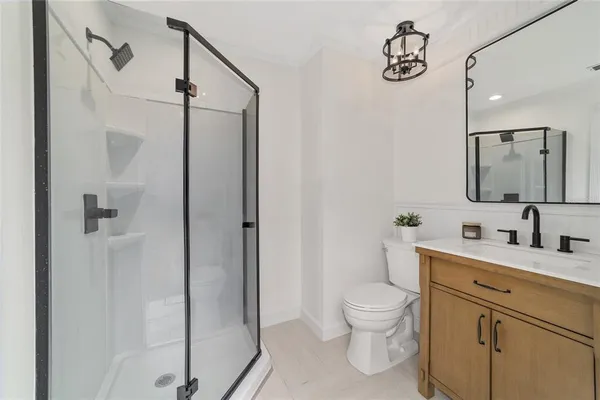 a view of a kitchen with a sink and cabinets