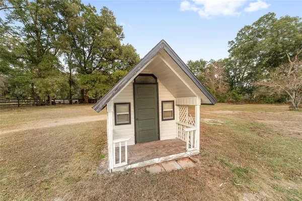 a view of a kitchen with a sink and a window