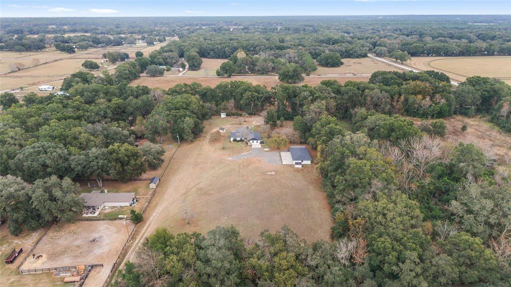 10575 Southwest 27th Avenue Ocala, FL 34476 - Photo 38 of 93 an aerial view of a house with a yard and lake view