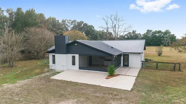 a house with trees in front of it