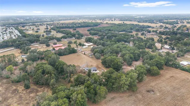 a kitchen with kitchen island a sink stainless steel appliances and cabinets
