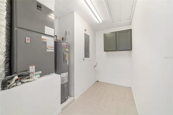 a kitchen with stainless steel appliances kitchen island granite countertop a refrigerator and a sink