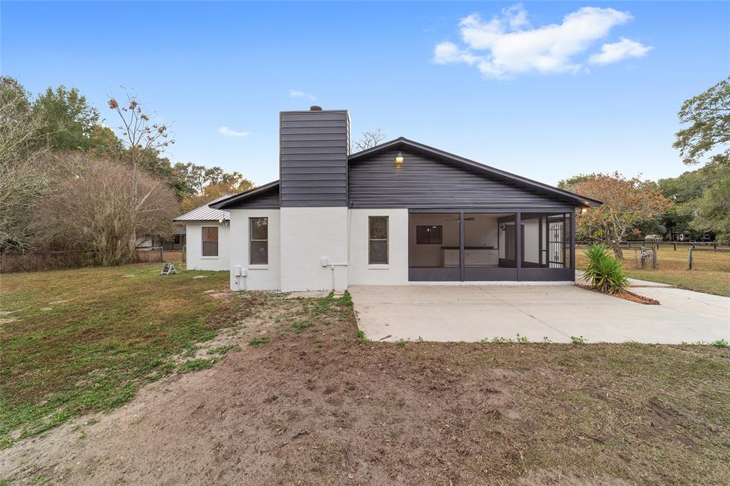 10575 Southwest 27th Avenue Ocala, FL 34476 - Photo 45 of 93 a front view of a house with a yard and garage