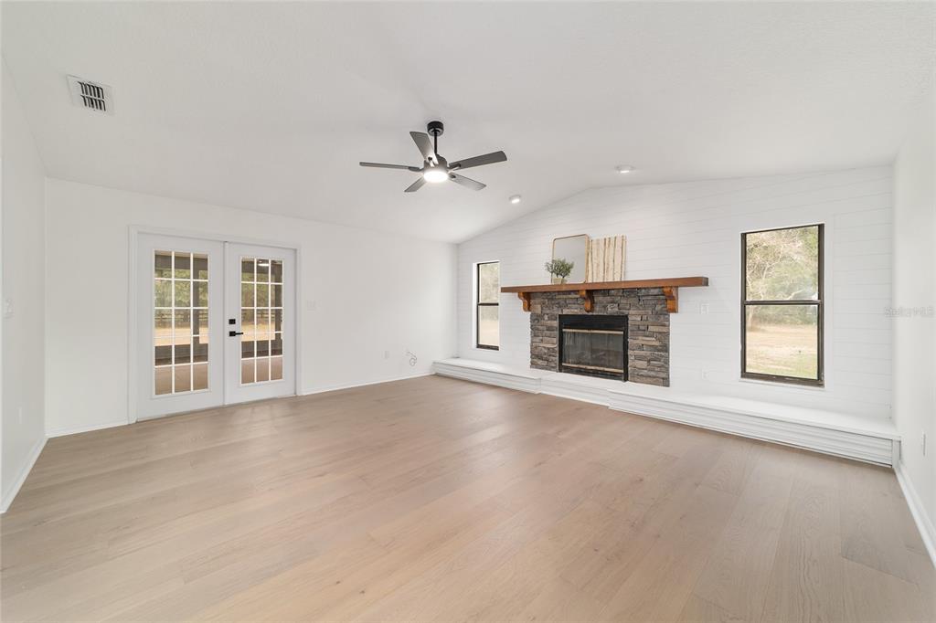 10575 Southwest 27th Avenue Ocala, FL 34476 - Photo 46 of 95 an empty room with windows and fireplace