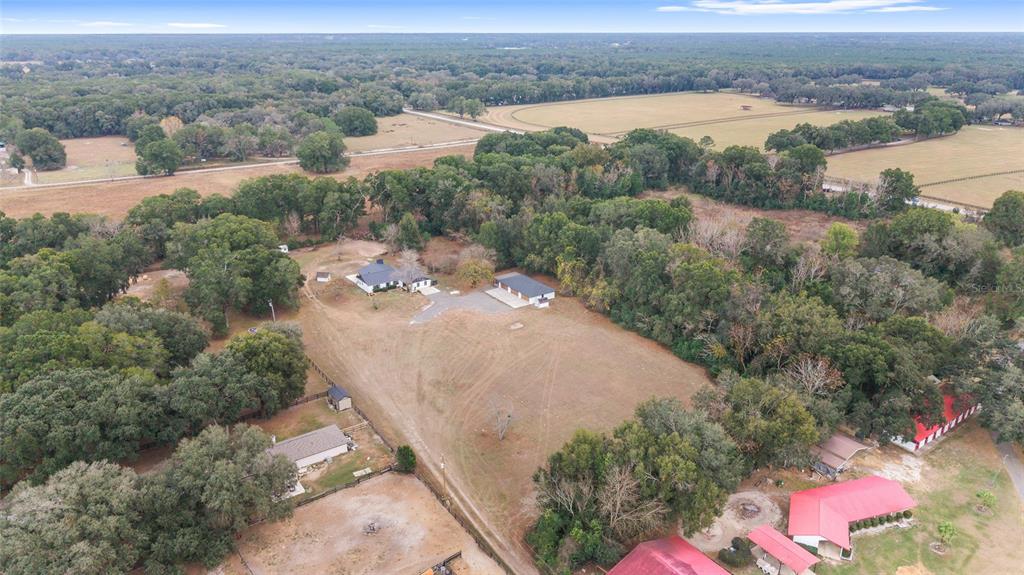 10575 Southwest 27th Avenue Ocala, FL 34476 - Photo 48 of 93 an aerial view of a house with a yard and lake view
