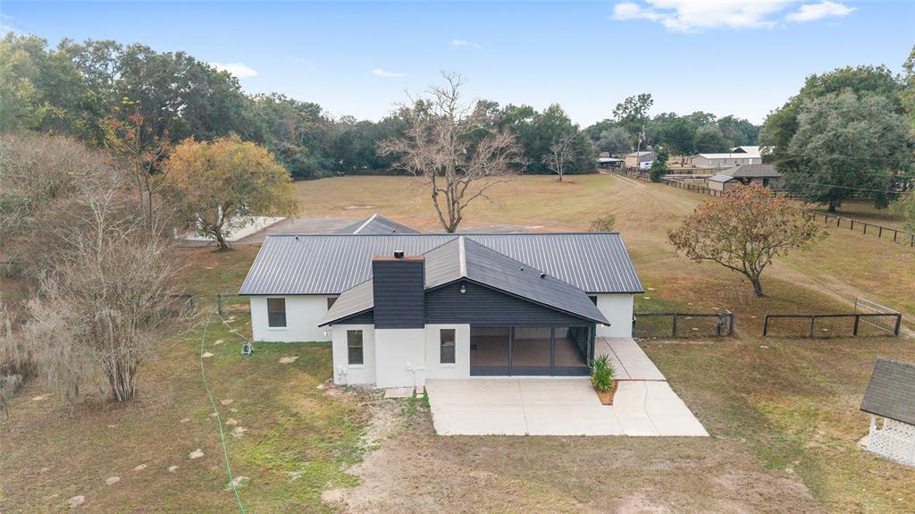10575 Southwest 27th Avenue Ocala, FL 34476 - Photo 49 of 93 a aerial view of a house with pool lake view and mountain view