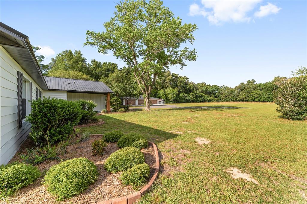10575 Southwest 27th Avenue Ocala, FL 34476 - Photo 65 of 95 a front view of a house with a yard
