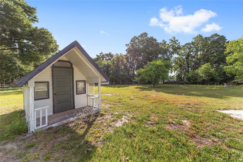 10575 Southwest 27th Avenue Ocala, FL 34476 - Photo 68 of 95 a view of a house with a yard
