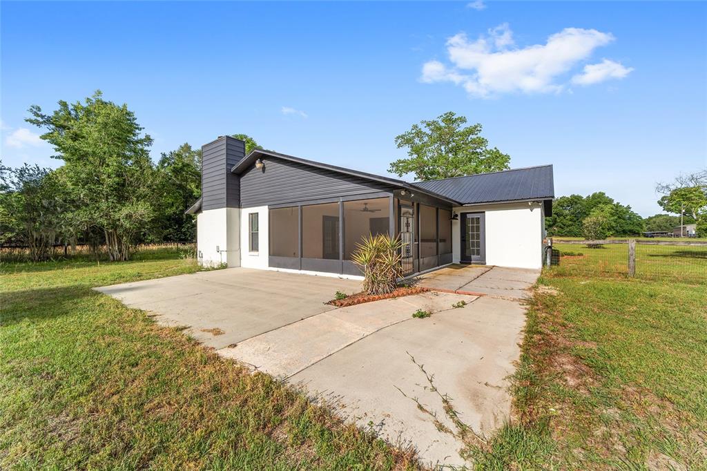 10575 Southwest 27th Avenue Ocala, FL 34476 - Photo 69 of 95 a front view of a house with a yard