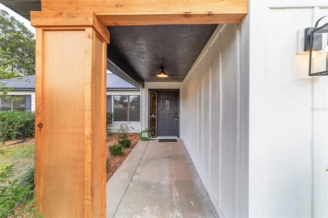 a view of empty room with ceiling fan