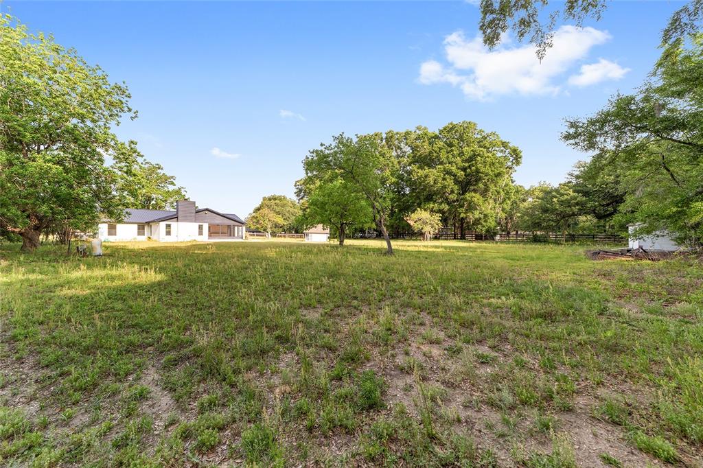10575 Southwest 27th Avenue Ocala, FL 34476 - Photo 71 of 95 a view of a green field with wooden fence