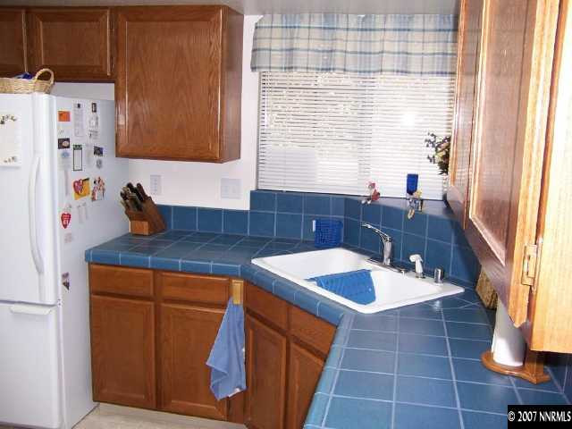 5340 Coit Drive Reno, NV 89523 - Photo 7 of 9 a kitchen with a sink cabinets and window