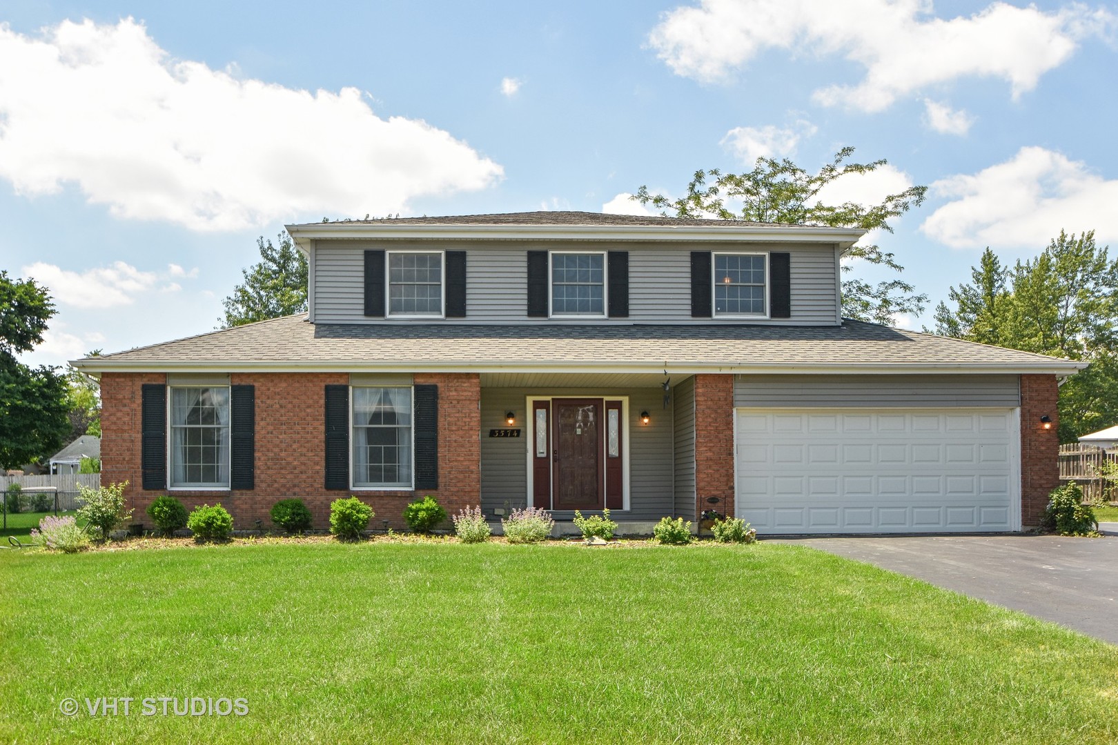 3574 Ronald Road Crete, IL 60417 - Photo 1 of 5 a front view of a house with a garden and plants