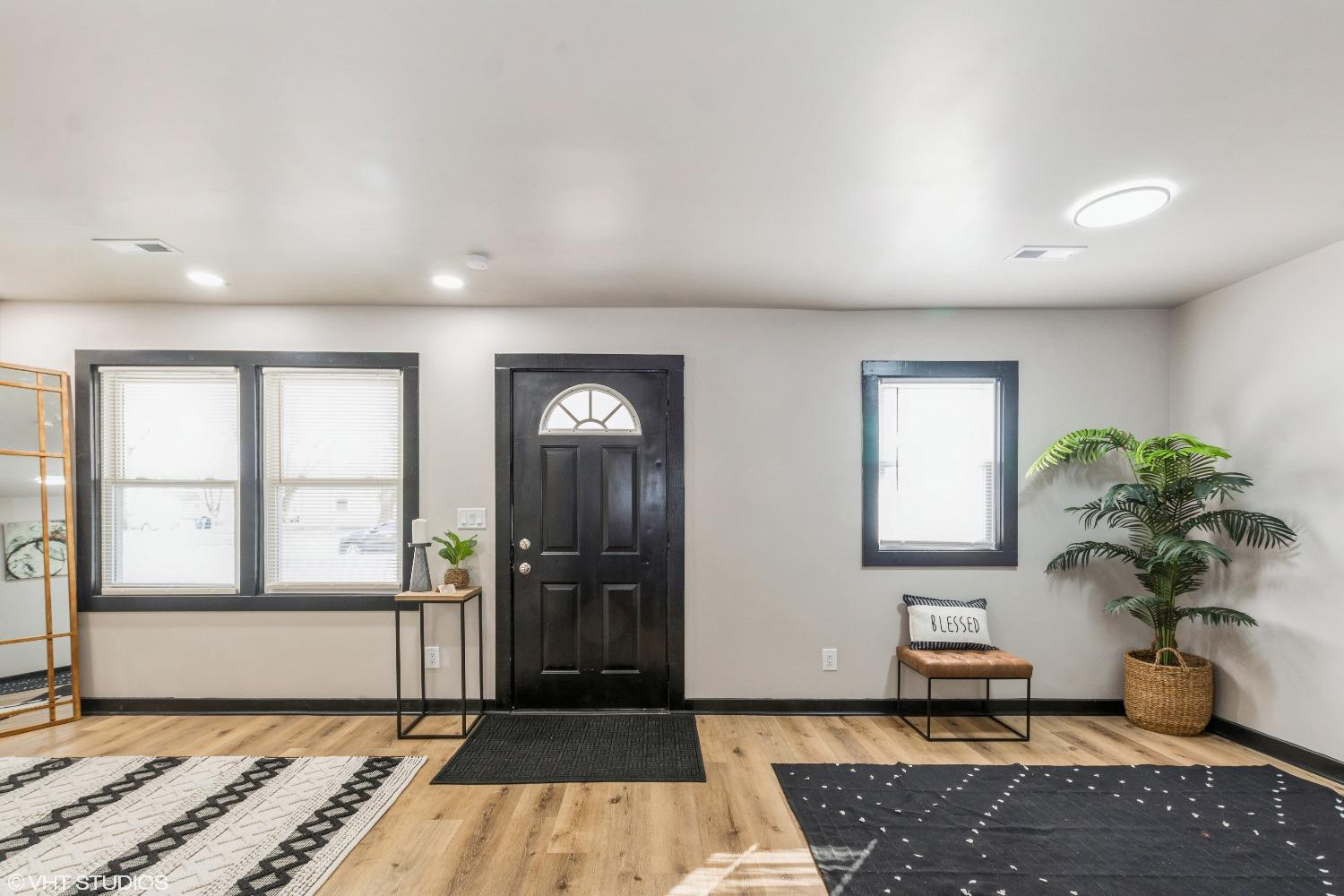 1103 Dearborn Circle Gary, IN 46403 - Photo 6 of 17 a living room with a couch and a potted plant
