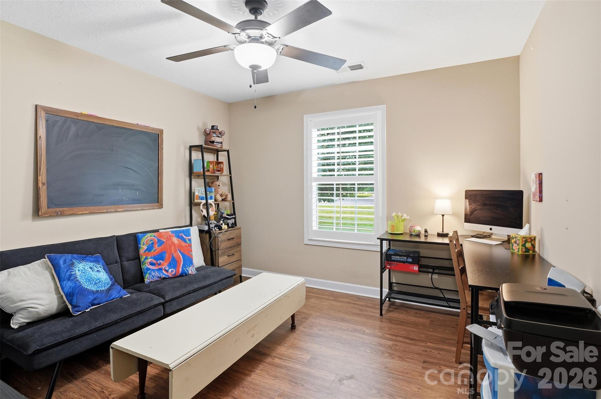 810 Tirzah Road York, SC 29745 - Photo 21 of 29 a living room with furniture and a flat screen tv with wooden floor
