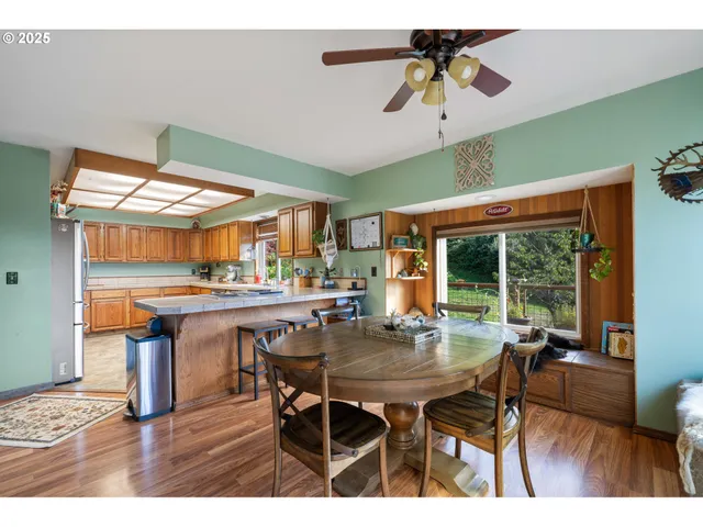 a dining room with furniture and window