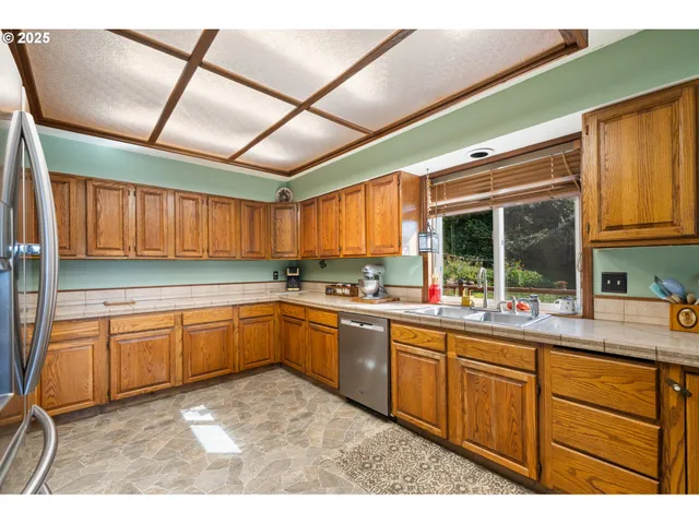 a kitchen with sink and cabinets