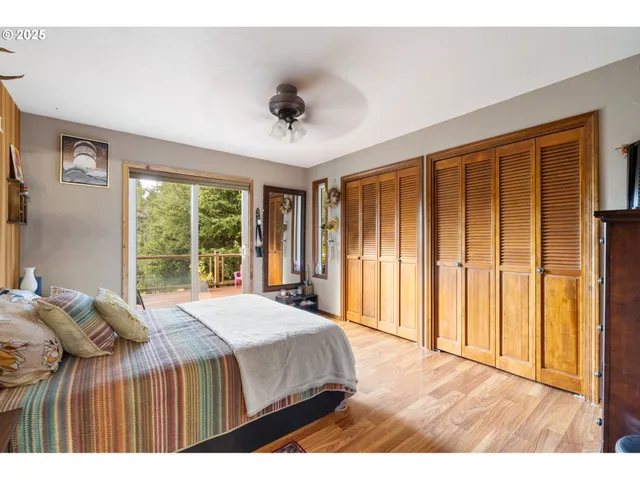 a bedroom with a large bed and a large window