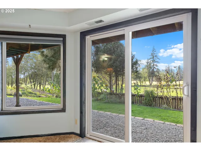 a view of a room that has a large window