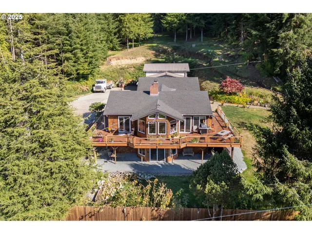 a aerial view of a house with balcony and garden