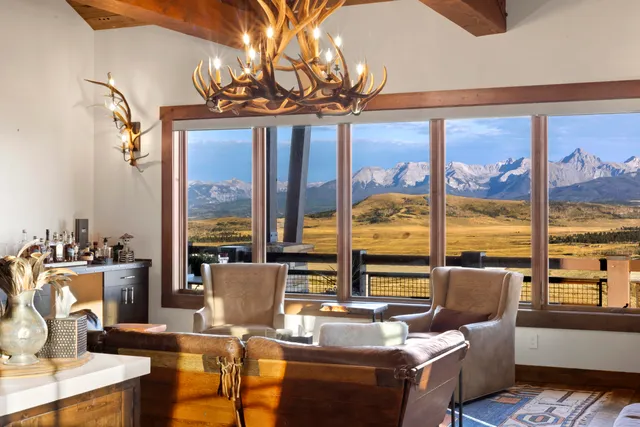 a kitchen with stainless steel appliances granite countertop a stove and a wooden cabinets