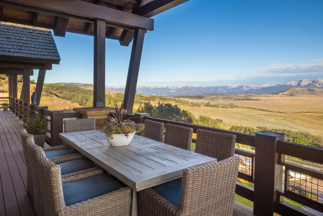 a view of outdoor space with seating space and city view