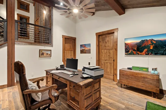 a bedroom with a bed a mirror and dresser