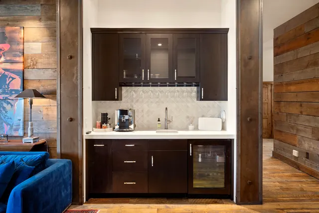 a bedroom with a bed couch and window