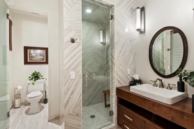 a living room with furniture tv and large window