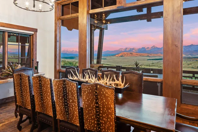a view of a chairs and table in a balcony