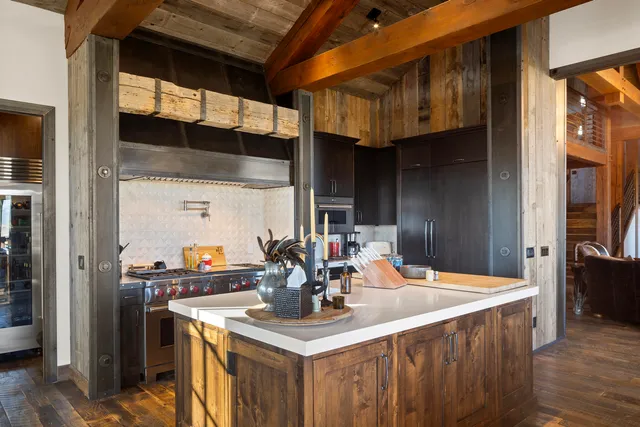 a living room with furniture a floor to ceiling window and a flat screen tv