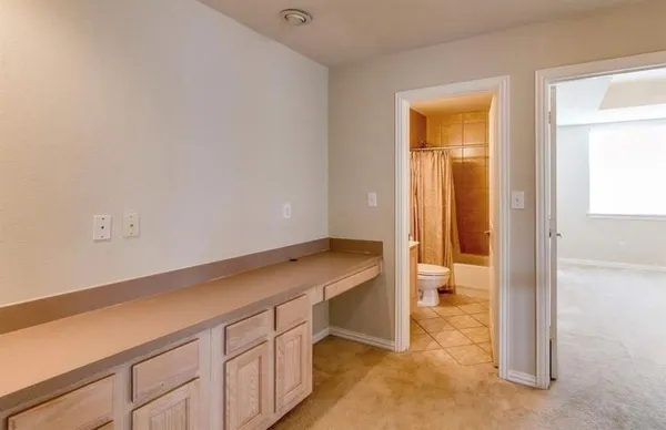 a room with a bed and a hallway