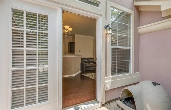 a bathroom with a toilet and a window