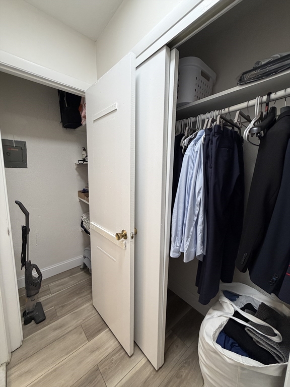 720 Bennington Street, Unit 207 Boston, MA 02128 - Photo 6 of 9 a view of walk in closet with clothes and shoes