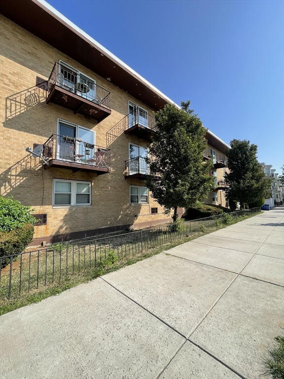 720 Bennington Street, Unit 207 Boston, MA 02128 - Photo 8 of 9 a view of a house with a patio