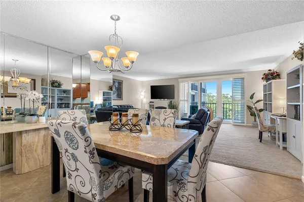 a kitchen with stainless steel appliances granite countertop a stove sink and cabinets