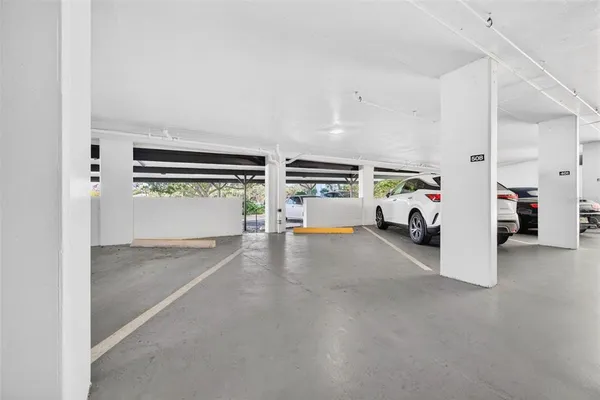 a front view of a building with potted plants