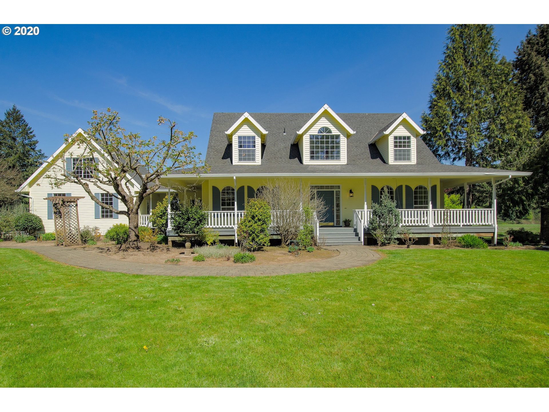 19303 Southeast Semple Road Damascus, OR 97089 - Photo 1 of 32 a view of house with garden and tall trees