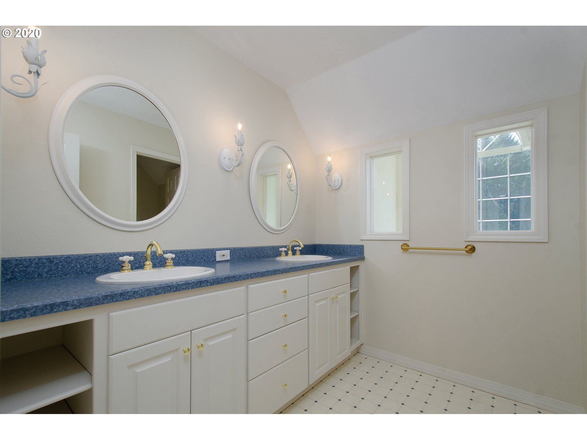 19303 Southeast Semple Road Damascus, OR 97089 - Photo 19 of 32 a bathroom with a granite countertop double vanity sinks and a mirror