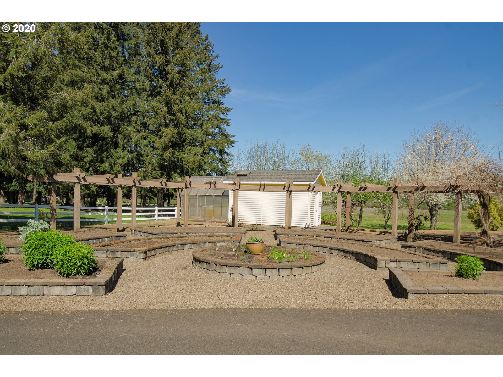19303 Southeast Semple Road Damascus, OR 97089 - Photo 29 of 32 a view of a swimming pool and trees in the background
