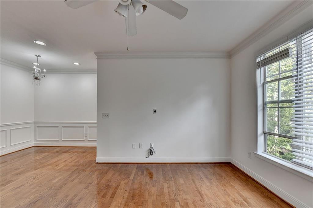 2202 Stratford Commons Decatur, GA 30033 - Photo 18 of 38 a view of an empty room with wooden floor and a window